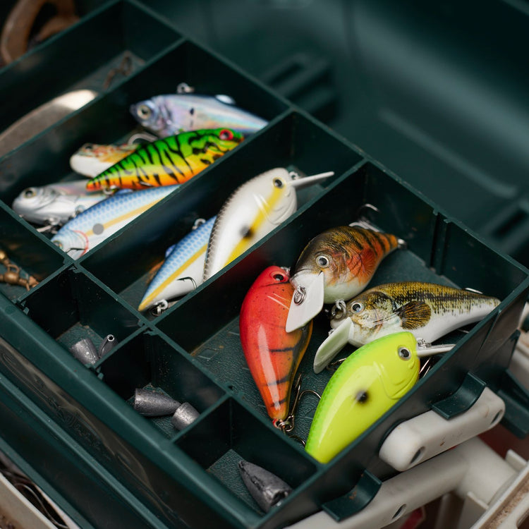 ReCast Fishing eco friendly sustainable recycled ocean plastic fishing lures, fishing equipment presented in a tackle box